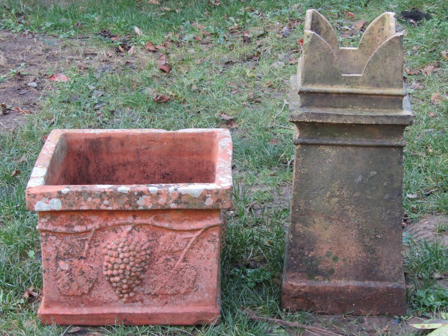 A weathered terracotta square cut and moulded planter, 48 cm square x 36 cm high together with a