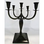 An early 20th century Just Andersen bronze candelabra table centre, with central sconce with four