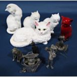 Five naive lead cast figures of cats, one emerging from a dust bin with fish carcass, another seated