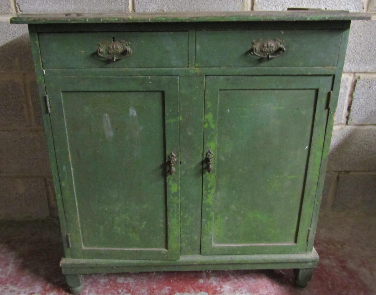 Late 19th century painted pine cupboard enclosed by two panelled doors and two drawers, 94 cm wide