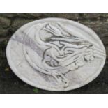 An oval carved marble plaque/tablet with bird and foliate detail, 40 cm x 30 cm approximately