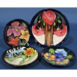 Four Moorcroft dishes all with floral detail, c.2010