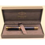 Parker Rollerball pen with blue feathered finish and gold coloured, box, paperwork and refill,