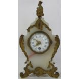 A small 19th century white onyx and brass overlaid rococo style mantel clock, enamel dial and