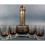 A Caithness smoked glass “Morven” decanter, designed by Domhnall O’Broin in 1965, with six