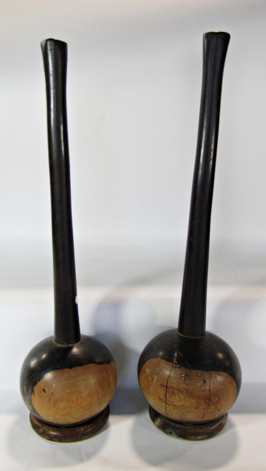 A pair of extremely heavy South African Knobkerrie, balanced on circular wood dishes. 48cm overall. - Image 2 of 2