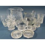 A quantity of mixed cut glass, including a water jug, various styles of glasses, tealight