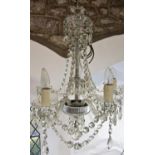 A Regency style five branch crystal chandelier with glass droplets.