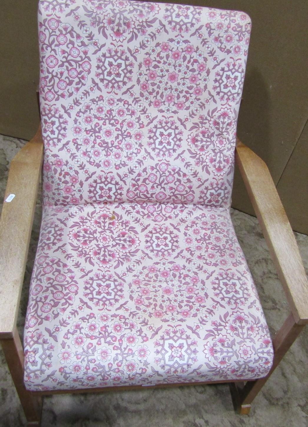 A vintage mid 20th century low oak framed rocking chair with combined upholstered seat and back - Image 2 of 3