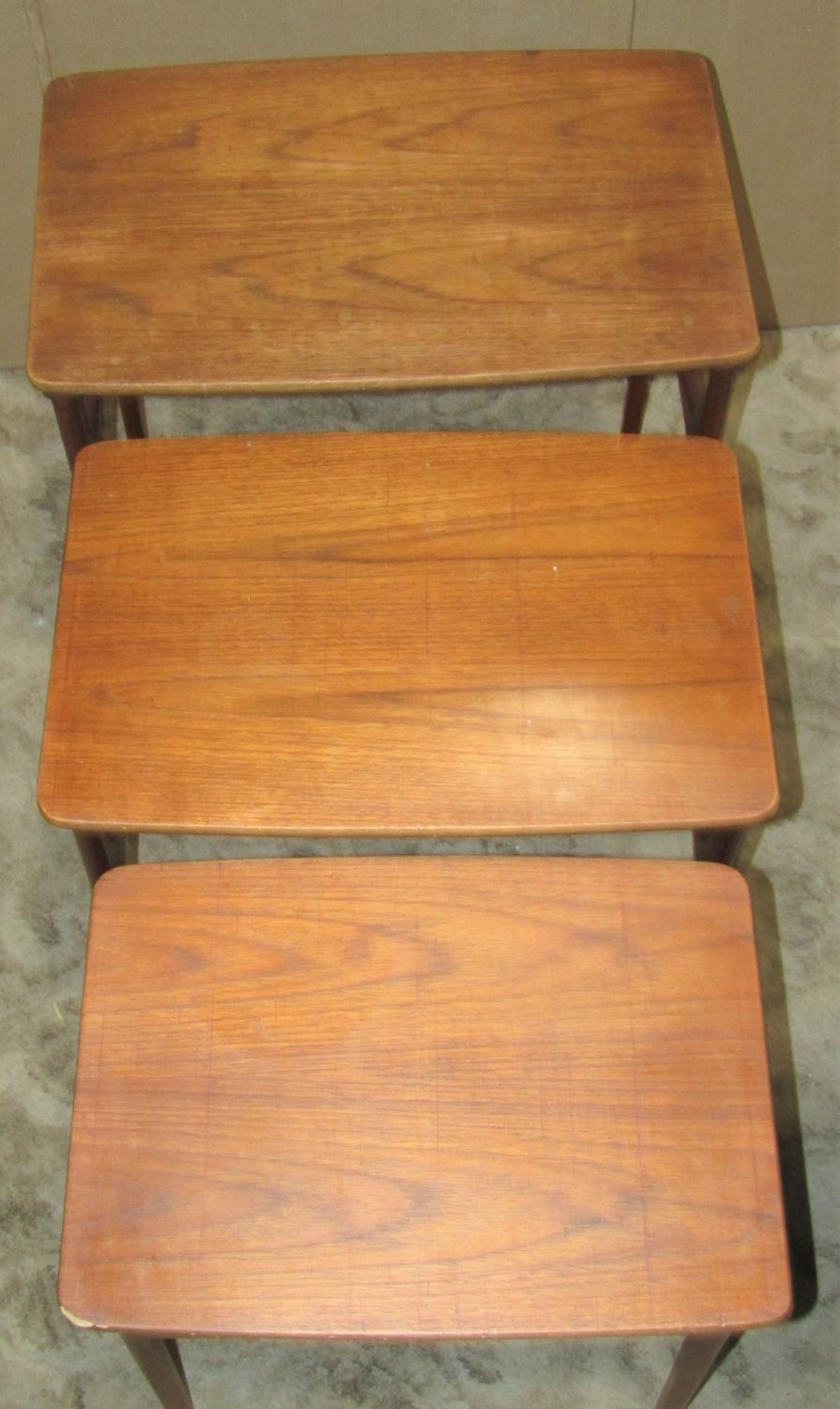 A nest of three retro Danish teak occasional tables raised on moulded tapered supports, smallest - Image 2 of 4