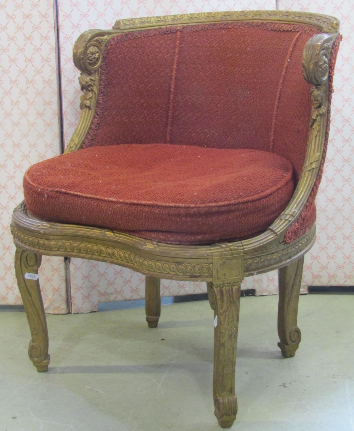 A small salon chair with gilt wood frame and upholstered seat