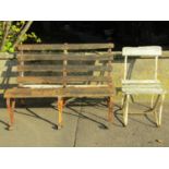 A weathered two seat garden bench with timber lathes and sprung steel supports, together with an