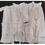 Eight late 19th/ early 20th century good quality baby gowns, with various designs of lacework,