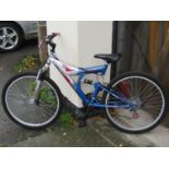 A silver Bandit all terrain mountain bike with grip shift gearing (almost new, unused gift)