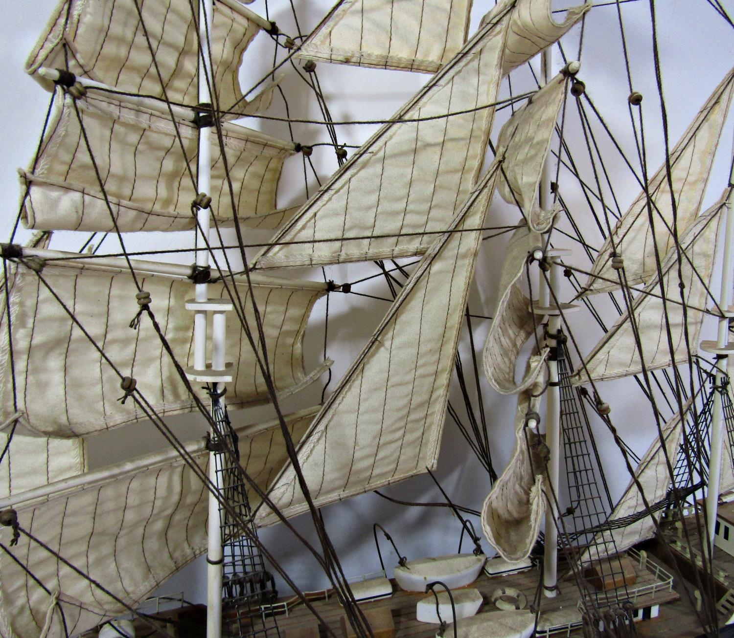 A wooden model of a three masted sailing ship in full sail, on a wooden stand, 79cm long x 67cm high - Image 2 of 2