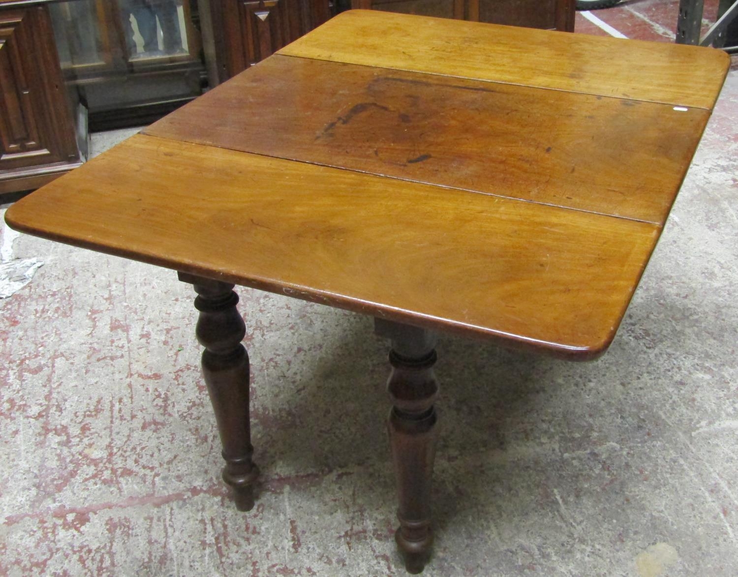 A 19th century mahogany drop leaf dining table on four turned supports, the top with swivel action - Image 3 of 6