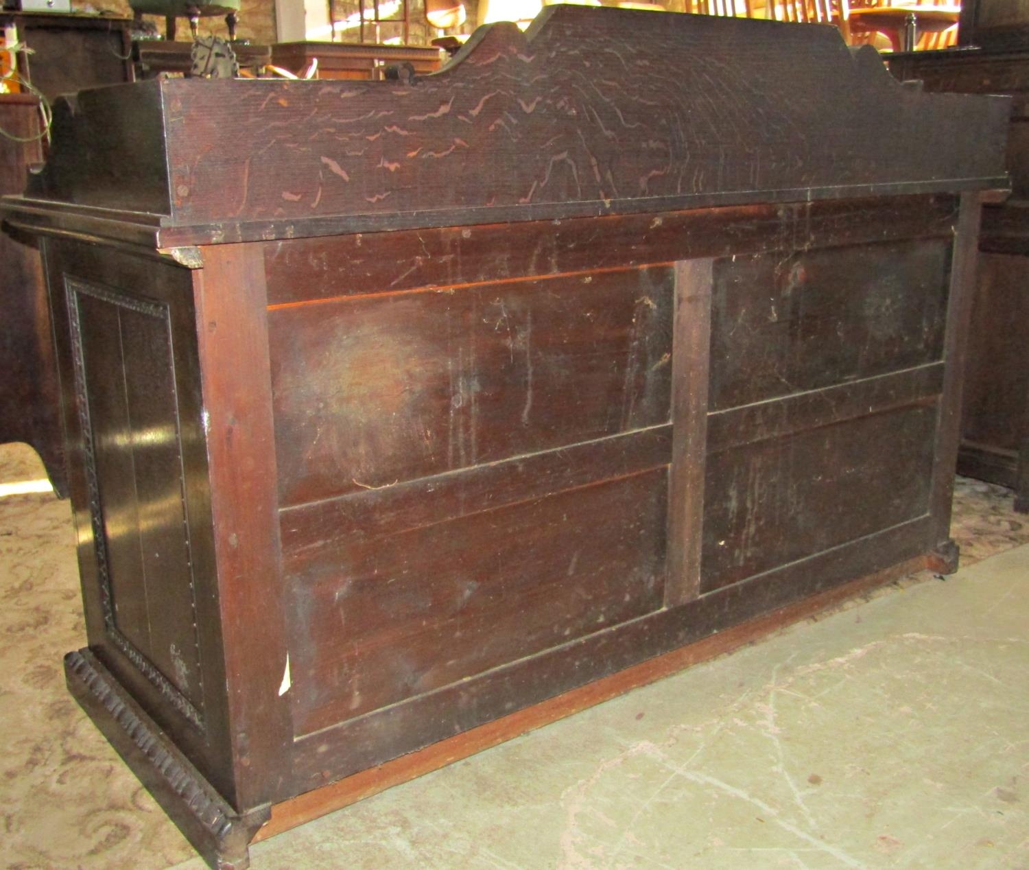 A substantial 19th century oak side cupboard enclosed by a pair of panelled doors, oval portrait - Image 2 of 4