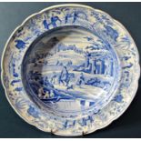 A 19th century blue and white transfer ware plate by Rogers showing a Giraffe and characters in a