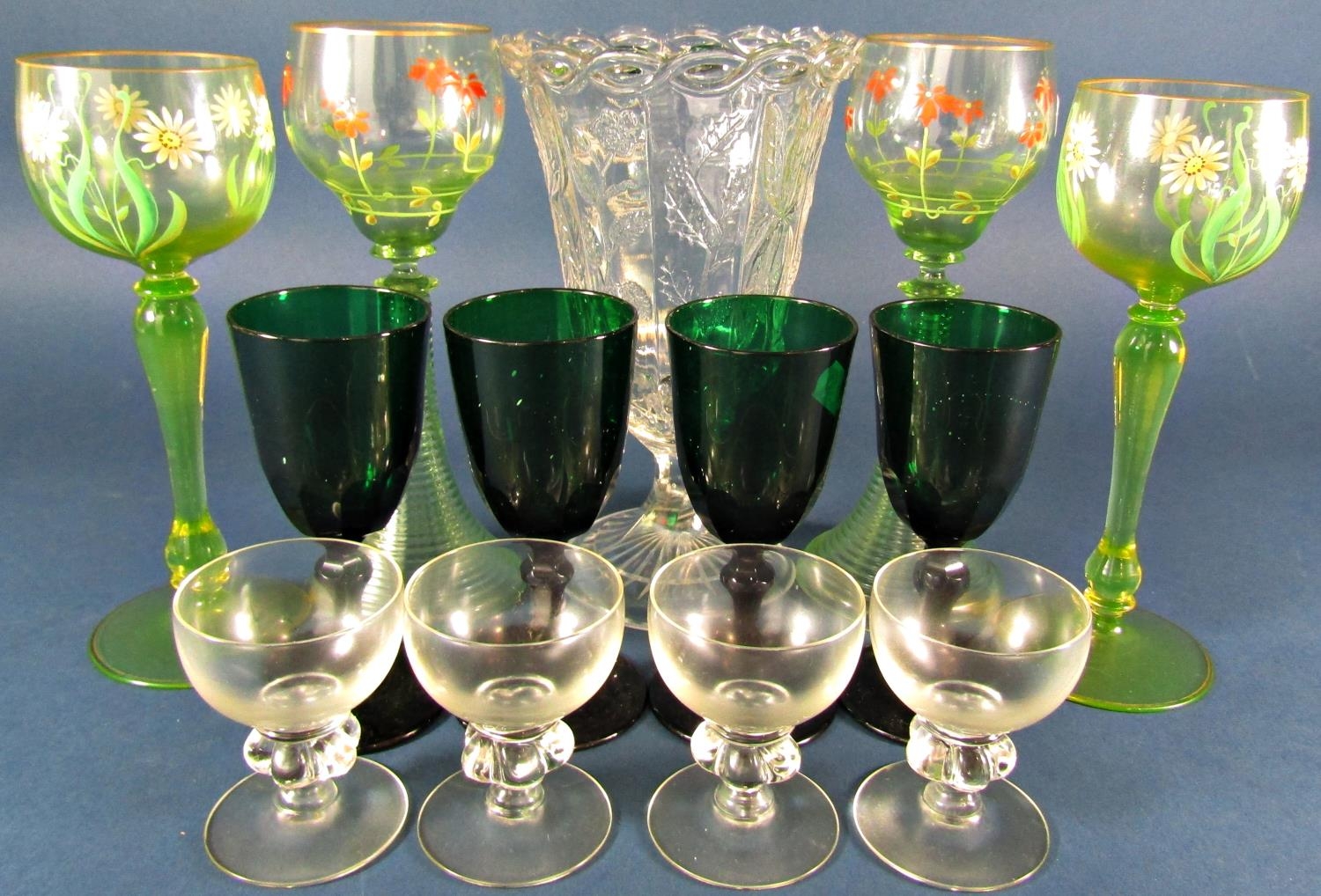 A miscellaneous collection of glassware including decorative floral hock glasses, vases, Georgian