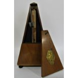 A vintage Maelzel pyramid metronome 23cm high.