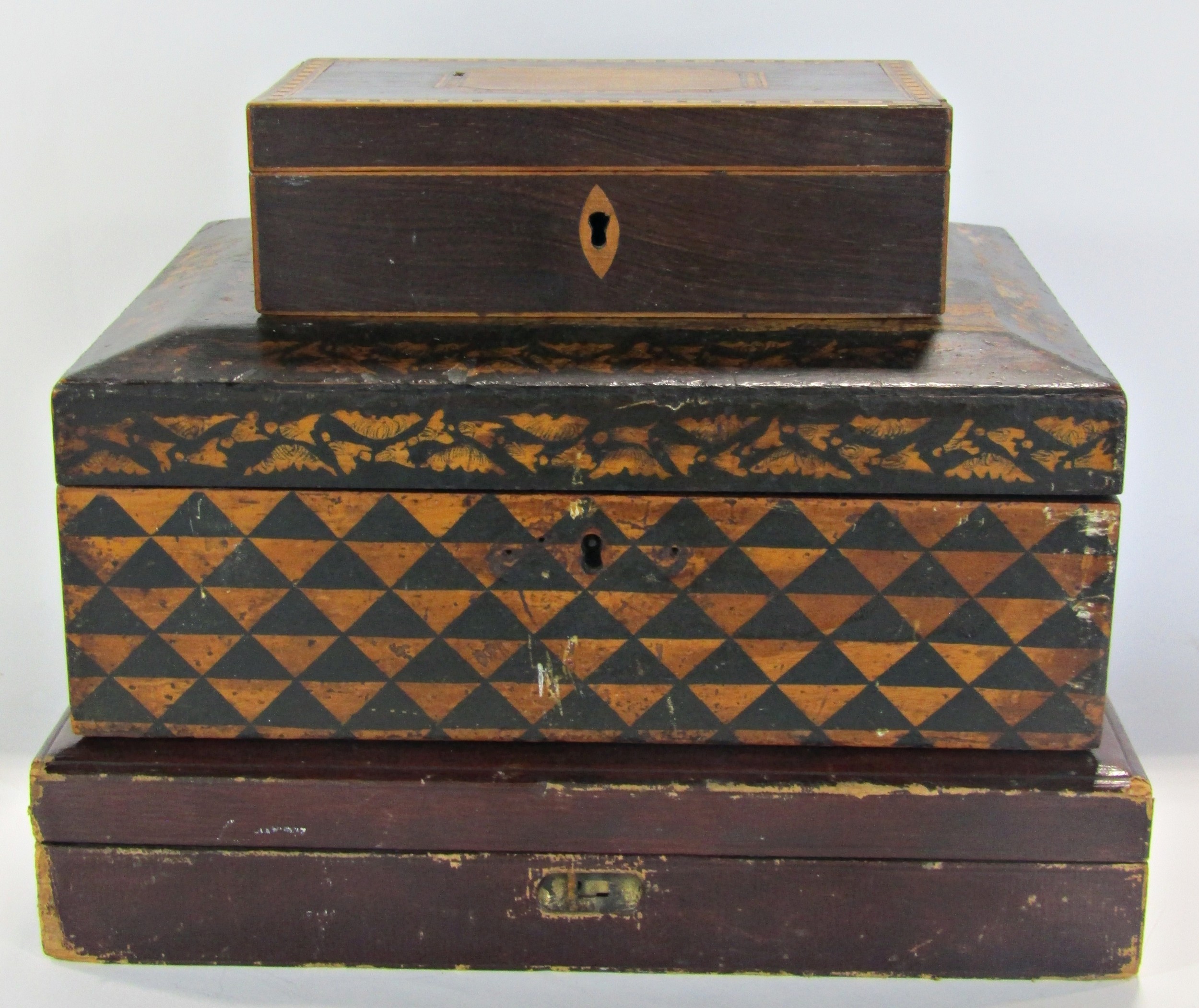 A 19th century Chinese design box with black and gold lacquered finish, a burgundy red leather bound