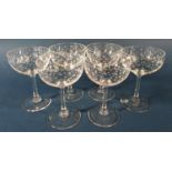 Twelve star etched Champagne bowls, four Champagne bowls with facetted stems and three Champagne