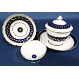 A Worcester crescent sugar bowl cover and stand, with further matching tea bowl and saucer all