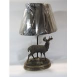 A bronze effect finished Monarch of the Glen table lamp raised on a plinth base with a leather