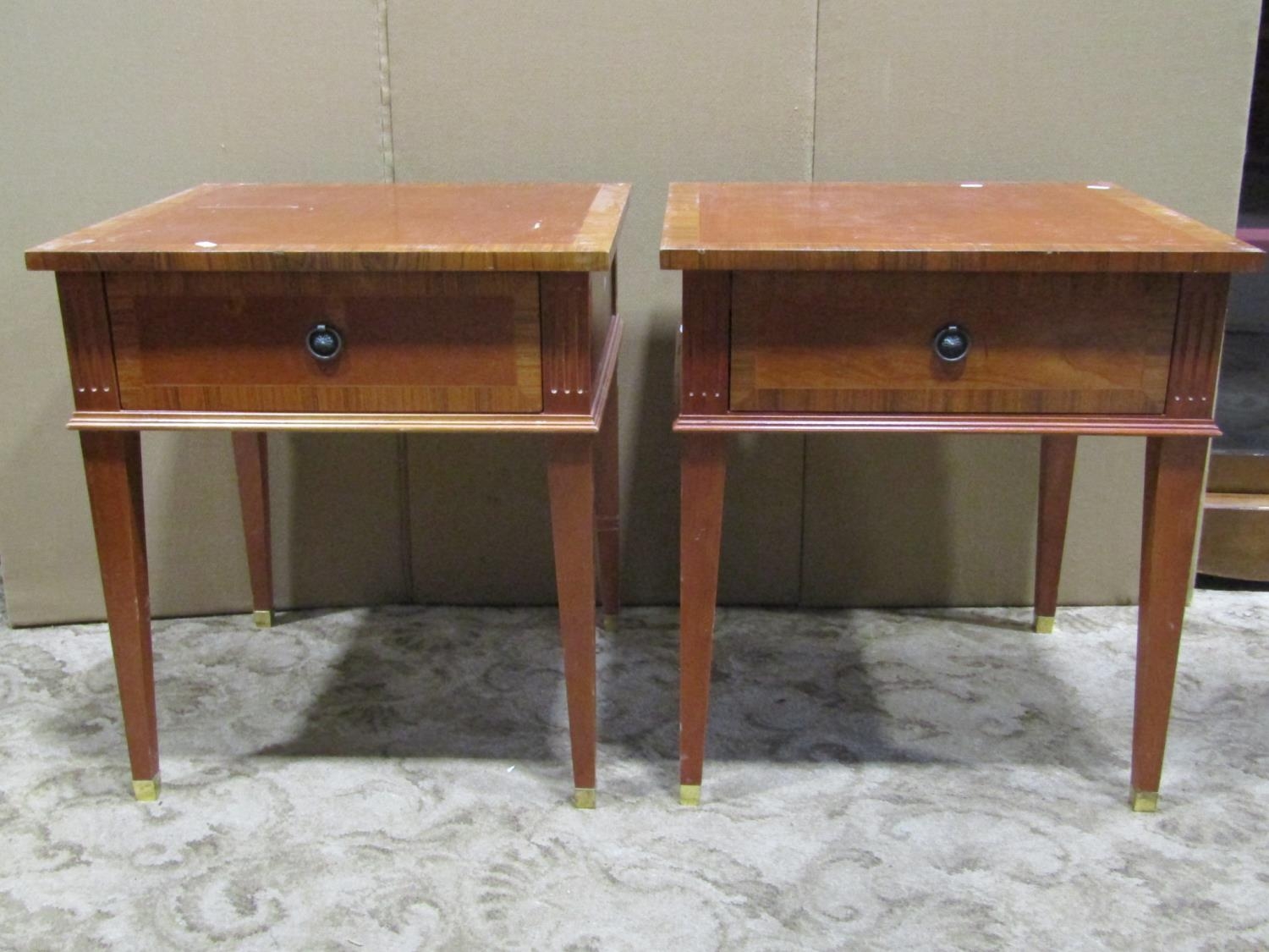 A pair of reproduction cherry wood low side/lamp tables, each with frieze drawer, rosewood cross