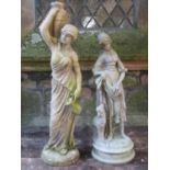 A weathered cast composition stone garden ornament in the form of a standing classical female