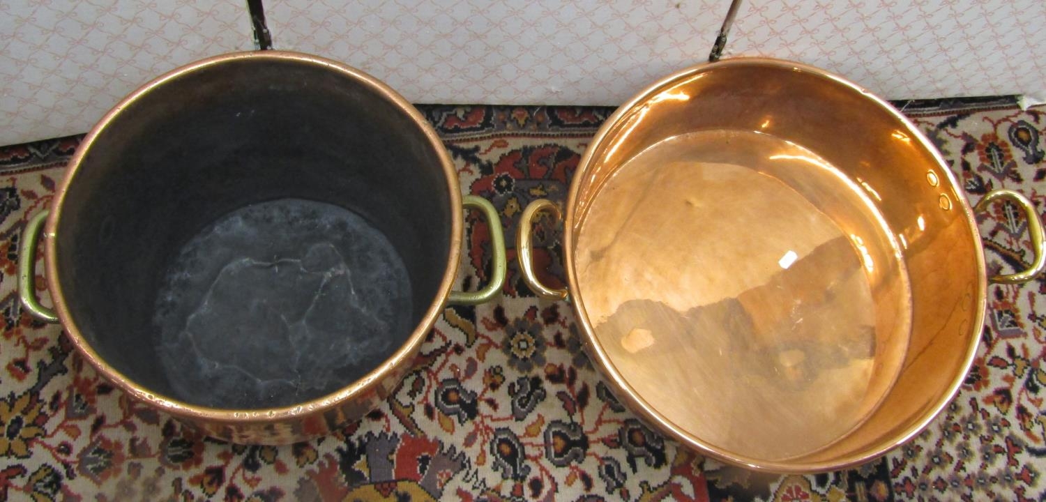 A heavy 19th century copper pot with brass an iron handles, 40cm diameter, together with a large - Image 3 of 3