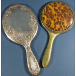 A silver backed oval hand mirror, Birmingham 1905, maker Deakin & Francis, together with a further