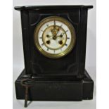 Victorian black slate mantel clock, the eight day striking movement with visible escapement
