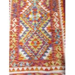 A Chobi kilim runner with a central repeating diamond pattern, 197cm x 66cm approx.