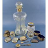 A glug waisted decanter with a silver collar, four vesta cases, a small inkwell, a pair of silver