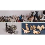 A large collection of whimsical cats and dogs including a Winstanley cat, three Doulton figures,