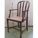 An inlaid Edwardian open elbow chair with pierced splats, upholstered pad seat and tapered supports,