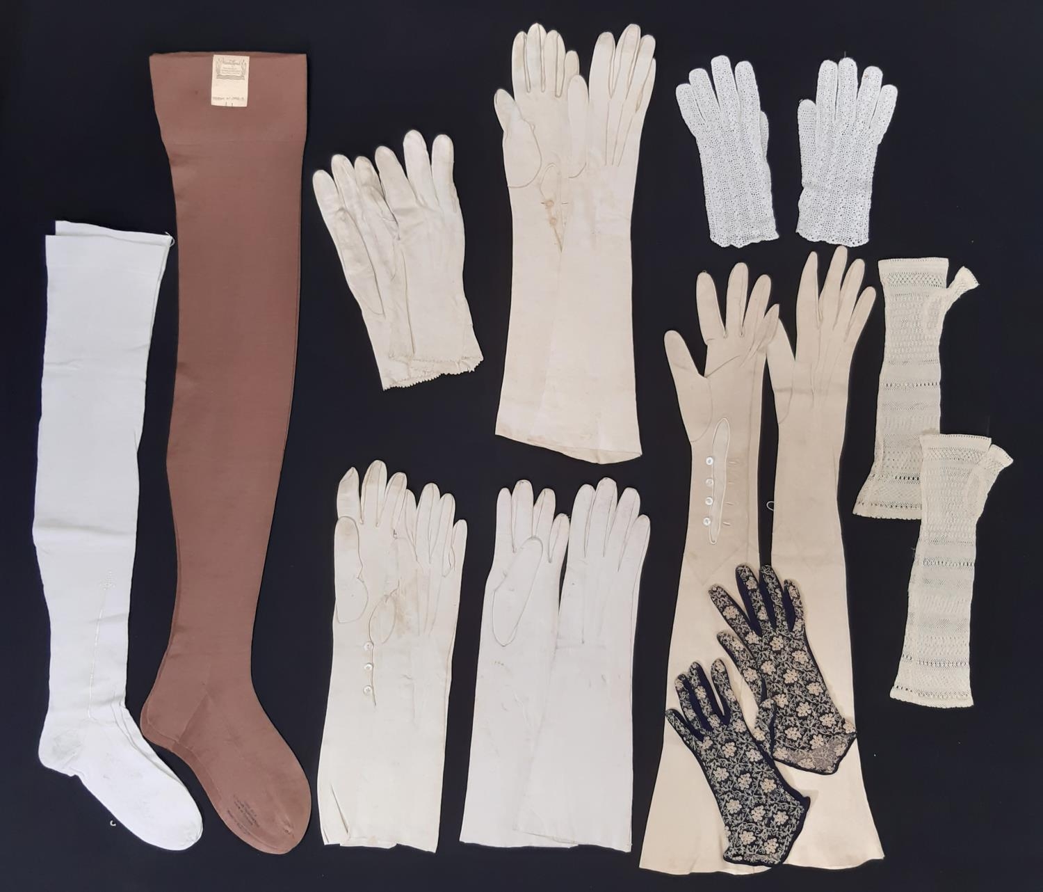 Collection of late 19th to mid 20th century stockings and gloves, including 1940's brown silk/
