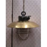 A good quality retro cast iron and polished brass industrial light burning a single bulb, 85 cm