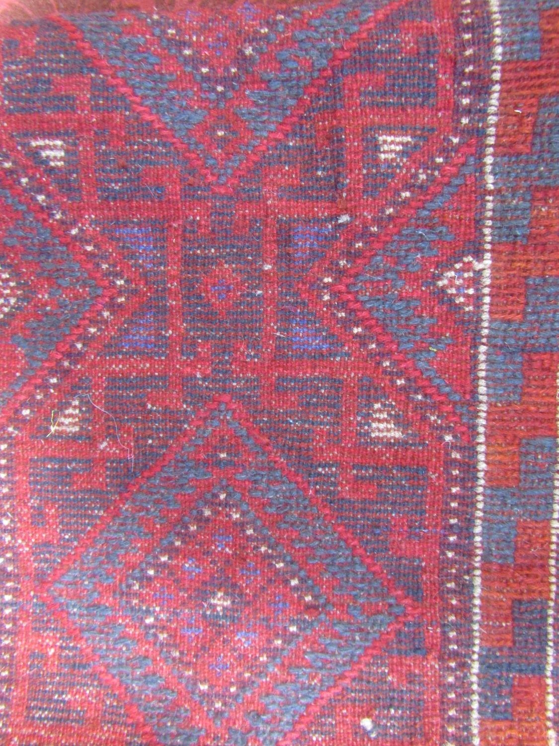 A Meshwani runner with a predominantly red and blue geometric pattern, 234cm x 57cm approx. - Image 3 of 3