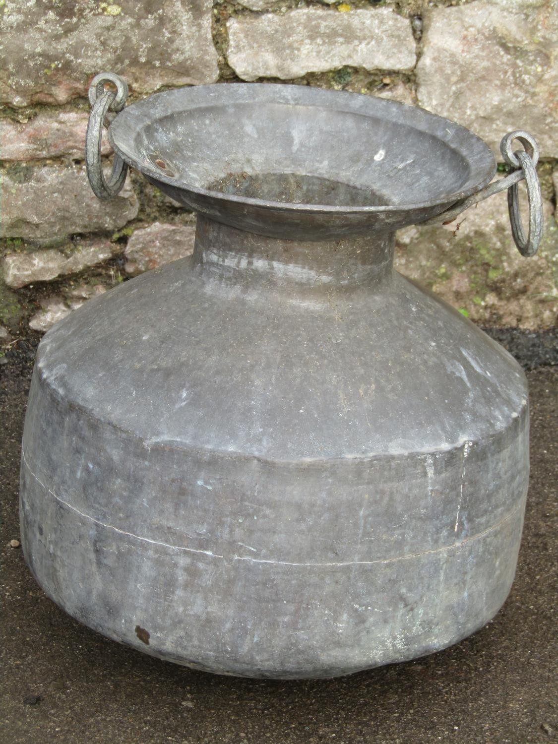 An eastern heavy gauge verdigris metal vessel with ring handles