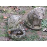 Two weathered cast composition stone novelty garden ornaments in the form of pigs, seated example 42