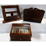 A mahogany watch display case, two collapsible book stands, and four boxed Minster Giftware