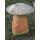 A small weathered cast composition stone staddle stone of traditional form with domed cap, 46 cm