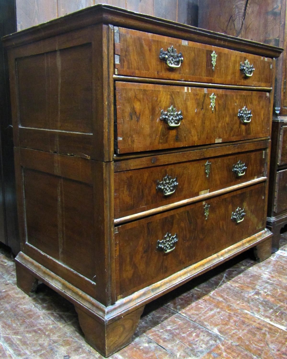 An antique countrymade chest of four long drawers, the carcass in two sections with figured walnut - Image 5 of 5