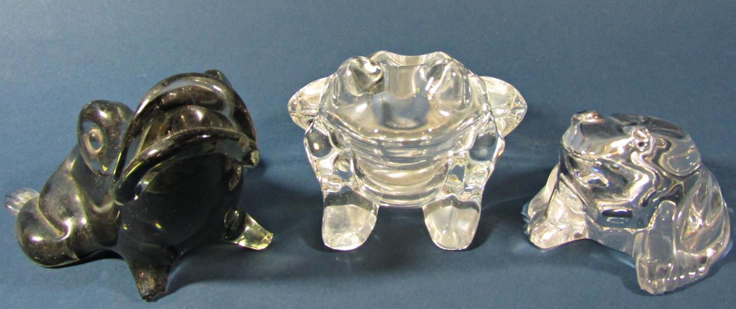 A small collection of five glass frogs, including a Murano Glass example, four other decorative