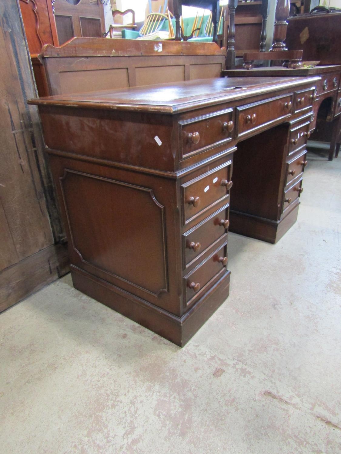 A reproduction mahogany kneehole twin pedestal writing desk, with inset leather panel top set over - Image 2 of 3