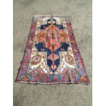 A North West Persian Viz rug with a large central elongated medallion with stylised flowers and