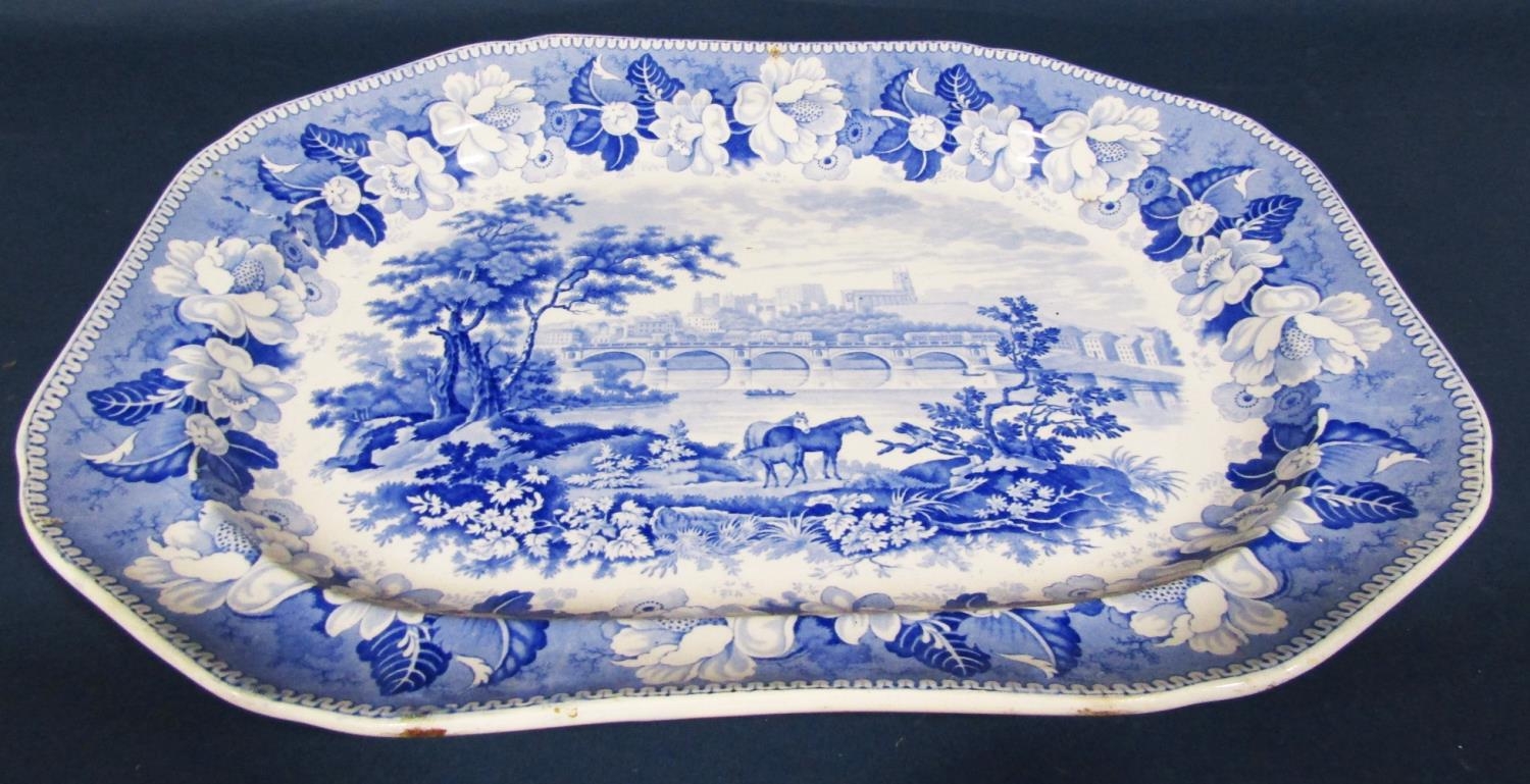 A large 19th century blue and white transfer ware plate an extensive seascape with distant castle