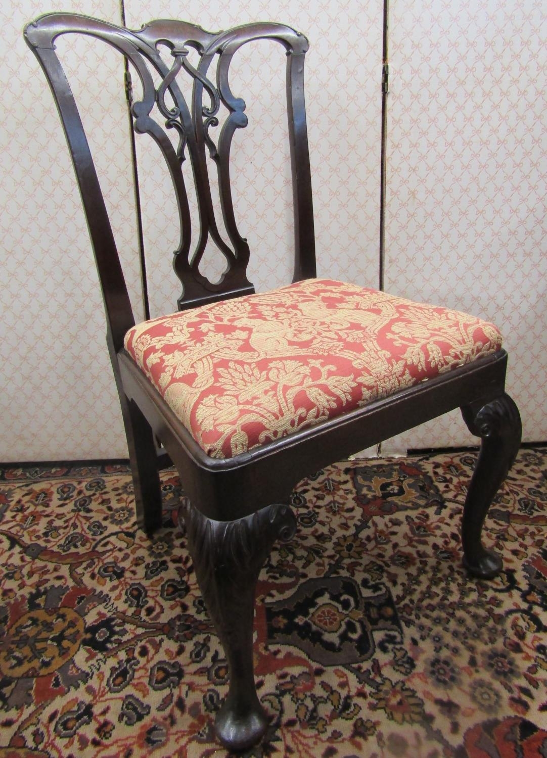A Georgian mahogany side chair with yoke shaped cresting rail, carved and pierced splat, drop in
